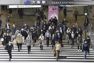 日本原計5月才要取消入境查驗新冠疫苗接種證明，日媒報導可能提前在4月29日實施。圖為大阪市區街景。（資料照／美聯社）